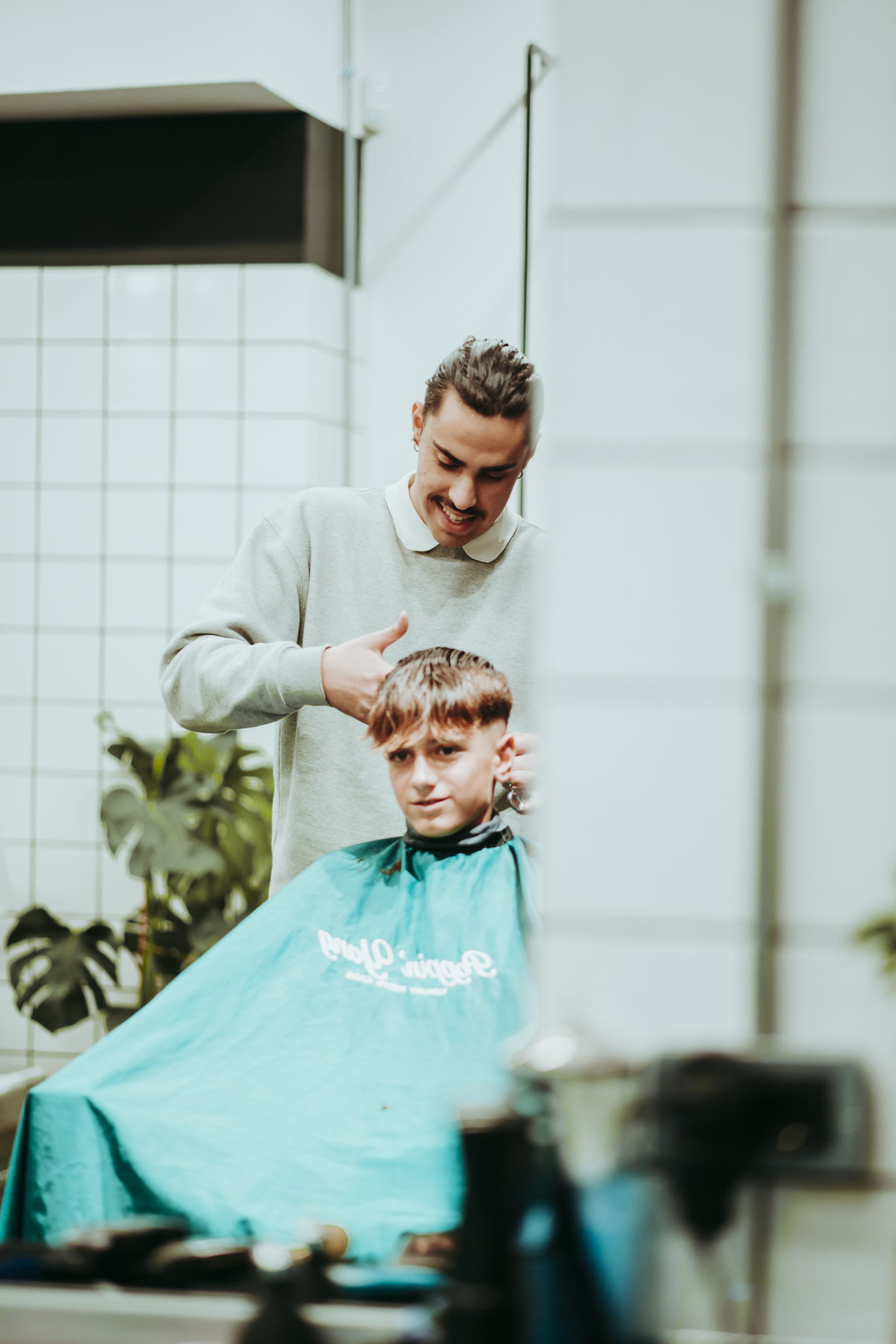 Barber styling a client