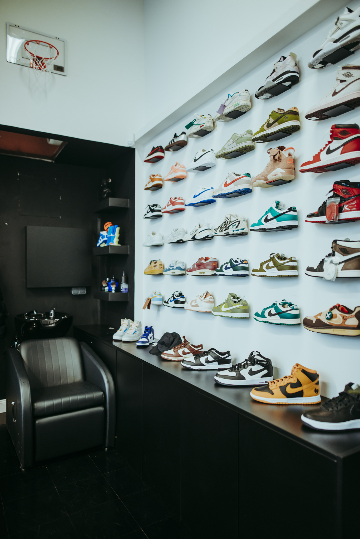 Head2Toe barbershop interior — sneaker wall and barber chairs