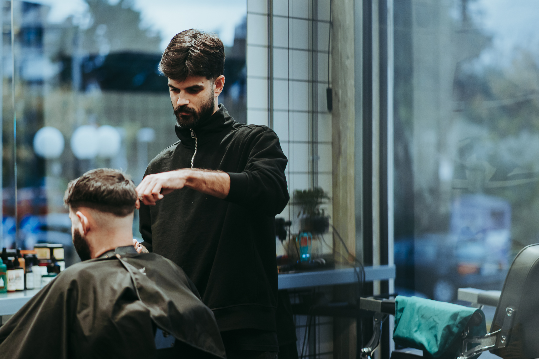 Barber at work through the window